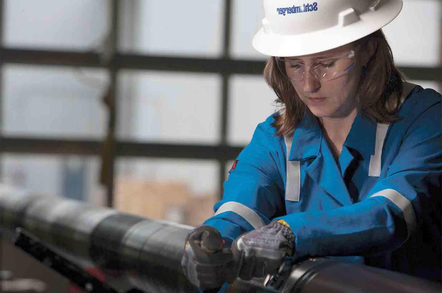 The image showing woman engineer working on the IRDV dual valve.