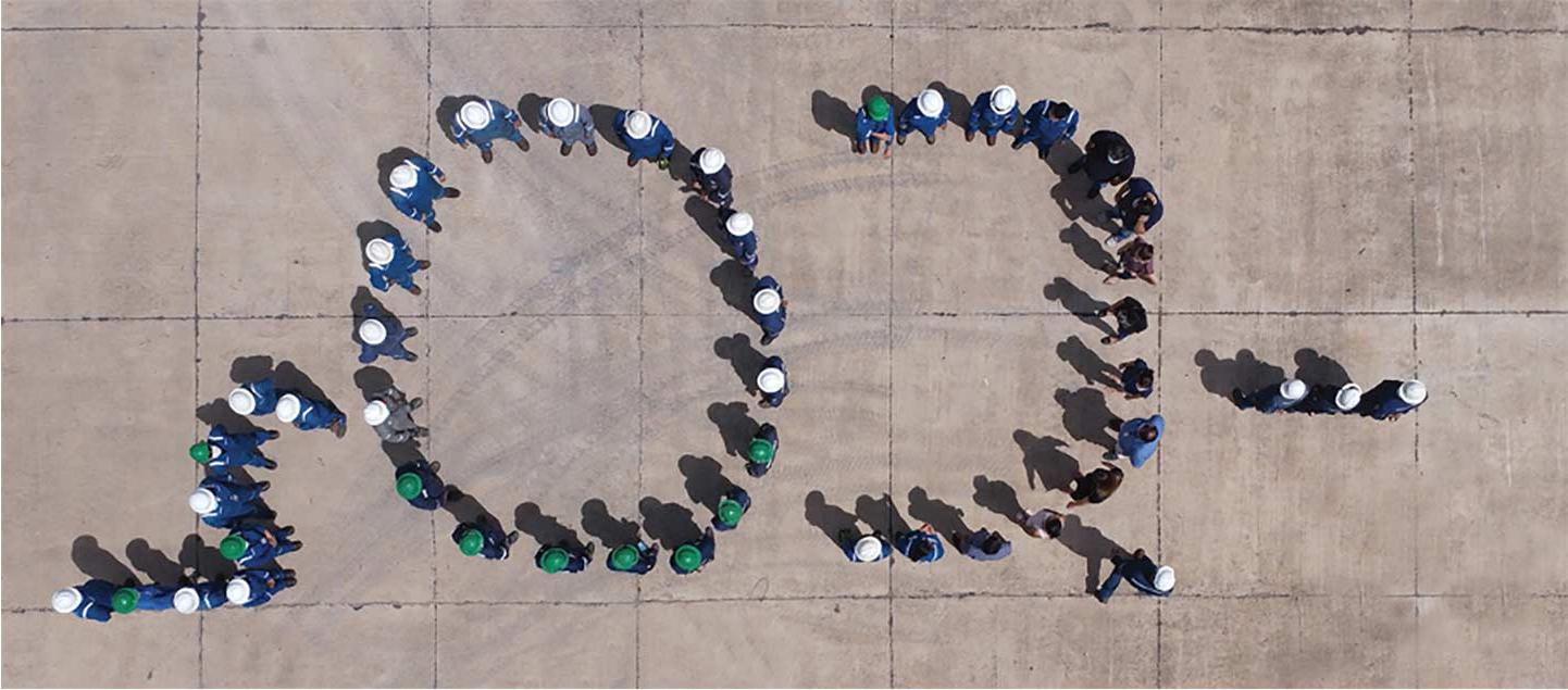 Overhead photo of people standing together to form the text CO2.