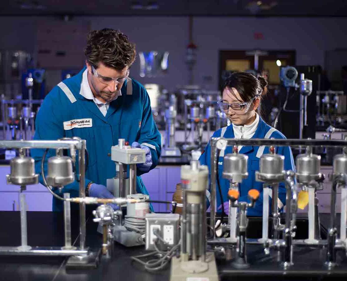 Schlumberger workers in the lab