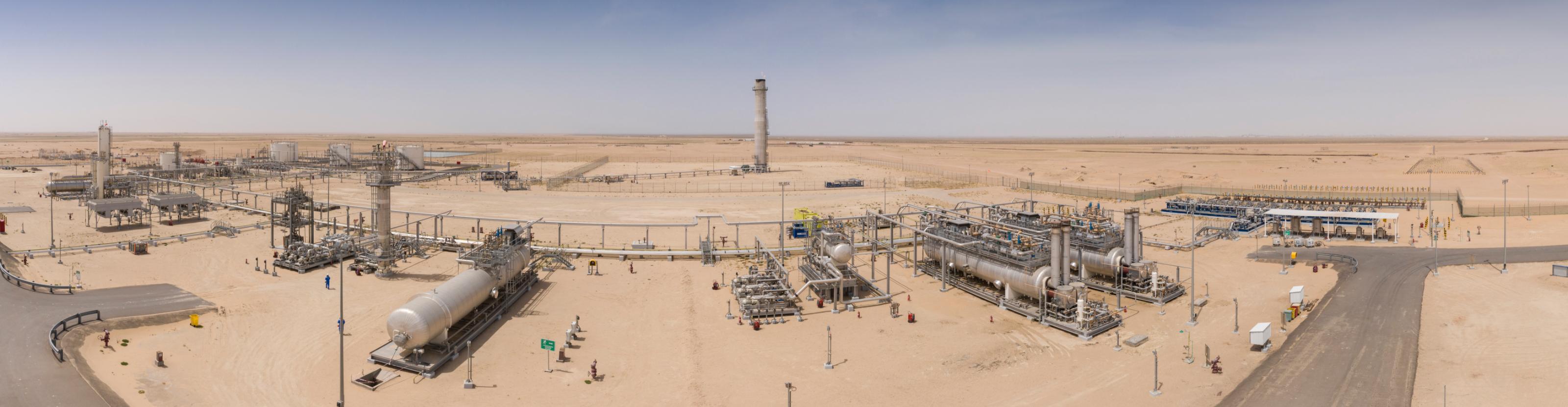 A desert processing facility with electrostatic oil treaters and other equipment.