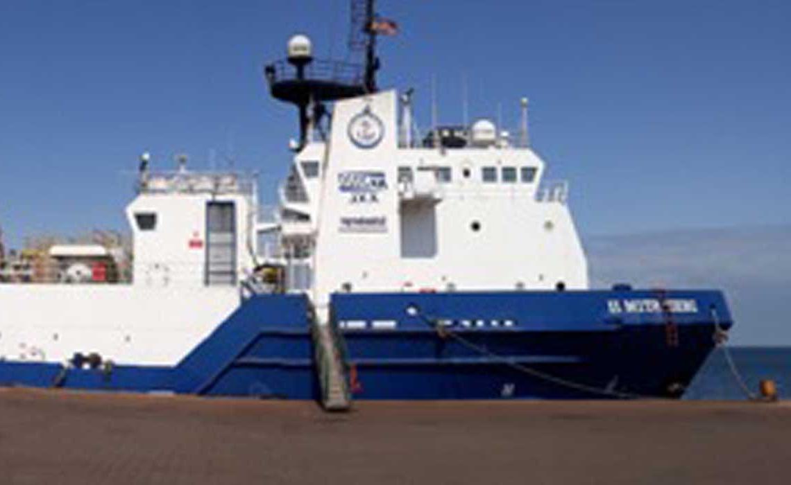 Blue-and-white DeepSTIM II vessel at the dock. 
