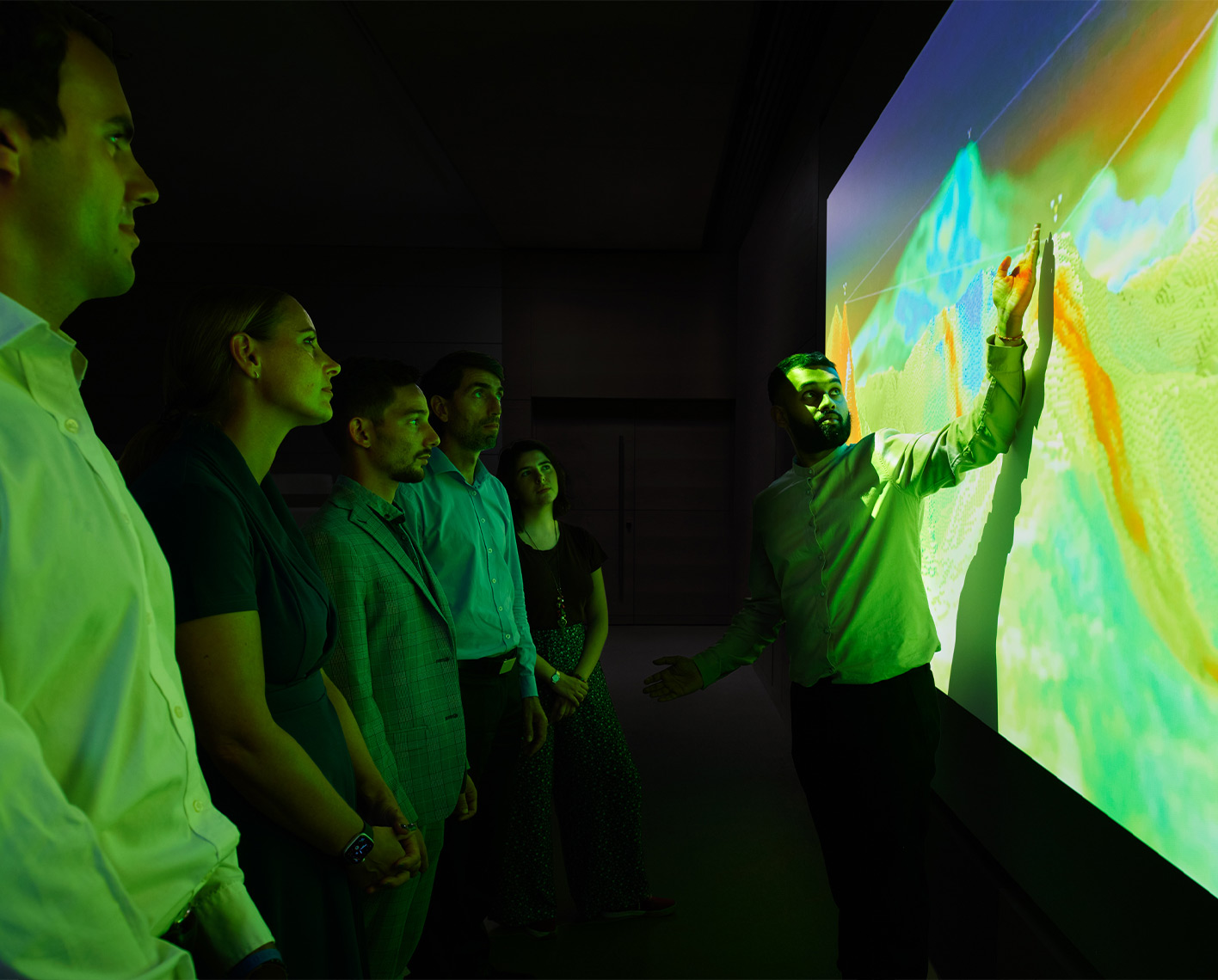 Group of people looking at a projection